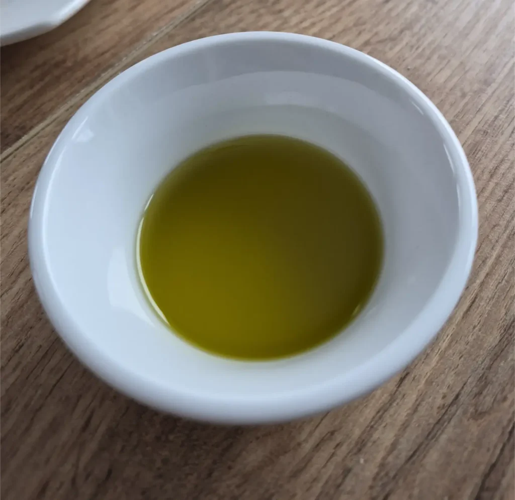 extra virgin olive oil from West Mani Greece and its vibrant colour - nice green in a white bowl